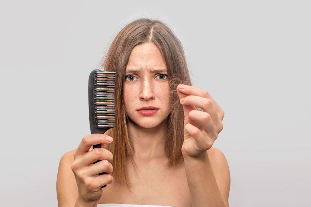 Woman undergoing Anti Hairfall Drip Treatment at Glam Aesthetics beauty clinic, Hyderabad